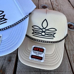 Tan Otto foam trucker hat with black western boot stitch graphic and decorative chain
