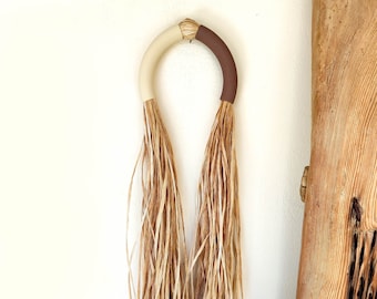 Ceramic like wall hanging arch with raffia fringe, modern creative neutral wall art, unique handmade artisan straw decor