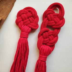 Red macrame decorative knots, wall hanging or door tassel, celtic square knot and josephine, minimalistic fiber art object, Christmas decor