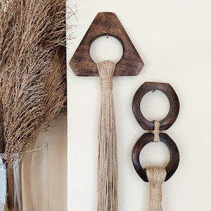 Decorative wall hangings with hand carved wood ring and long hemp tassel in triangle and double circle shape, modern creative wall sculpture