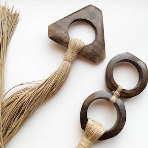 Decorative wall hanging set of two, made of wood and hemp twine. Comes in two different shapes: triangle and double circle.