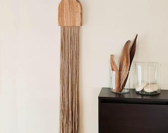 Minimalist wall hanging with wood and hemp, modern organic fiber art, vertical natural tapestry
