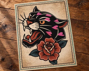 May include: A rectangular print featuring a black panther head with an open mouth, sharp teeth, and pink heart-shaped spots. Below the panther is a large red rose with green leaves. The illustration is framed by a thin border on a beige background.