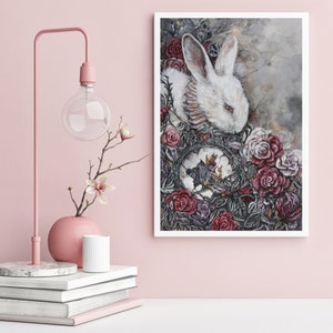 May include: A white rabbit with red eyes is nestled in a bed of red and purple roses. A clock face with Roman numerals is visible in the background.