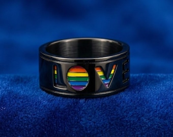 Subtle black stainless steel ring, 10mm wide dome band with hidden rainbow interior stripes.