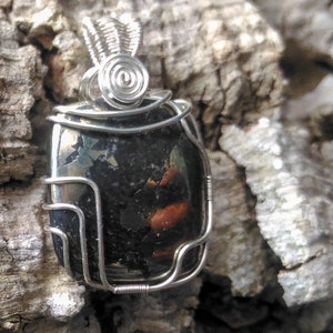 pendant of mineral Chalcopyrite set in filigree of 925 silver thread.