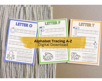 May include: Three alphabet tracing cards with the letters O, F, and T. Each card features a letter, tracing lines, and an illustration: an octopus, a fish, and a tiger. The cards are on a neutral background.