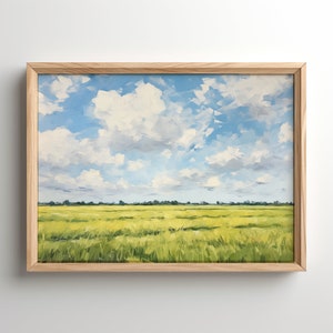 Puede incluir: Una pintura enmarcada de un paisaje con un campo de hierba verde y amarilla bajo un cielo azul con nubes blancas.