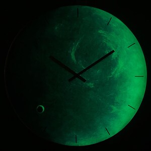 Elegant Neptune wall clock featuring a modern design. This large, unique clock is perfect for space decor and makes an ideal gift for astrology lovers celebrating the Pisces sign in a charming way. Blue accent decor. Blue wall clock. Nautical decor.