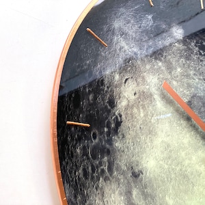 Glowing Moon wall clock with a celestial touch. Perfect for those who love astrology and minimalist decor. This large, hand-painted glass clock is ideal for modern interiors, yoga studios, or as a zodiac sign gift for Cancer.
