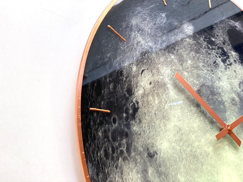 Glowing Moon wall clock with a celestial touch. Perfect for those who love astrology and minimalist decor. This large, hand-painted glass clock is ideal for modern interiors, yoga studios, or as a zodiac sign gift for Cancer.