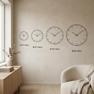 Jupiter glass wall clock size comparison guide for oversized celestial wall decor in modern home