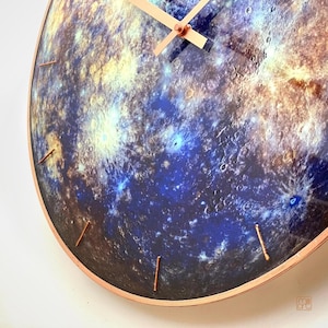 Elegant Mercury glass clock, featuring glow-in-the-dark magic. This celestial decor piece is perfect for modern interiors or as a unique gift for Gemini and Virgo zodiac signs. Handcrafted with an astronomy theme.