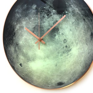 Lunar wall clock with a beautiful glow-in-the-dark effect. Hand-painted on glass, it's perfect for those who love astronomy and celestial decor. A great addition to yoga or office spaces, and a zodiac gift for Cancer.