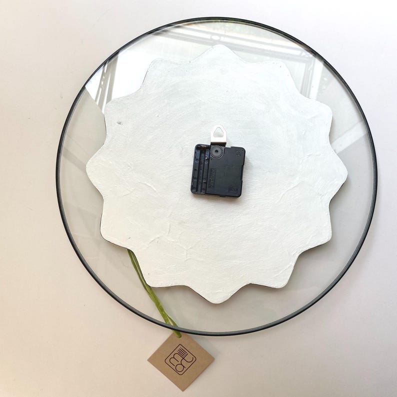Captivating glow-in-the-dark wall clock, meticulously hand-painted with magical waves. Its oversized design and gothic aesthetic with black finishing create a perfect focal point for boho-inspired interior. Unusual clock. Large clock. Quirky clock.