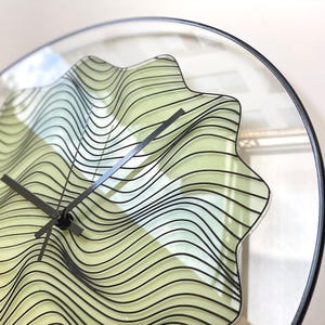 Enchanting hand-painted wall clock that glows in the dark. With a gothic design and black finishing, this oversized clock showcases beautiful magic waves, making it a perfect piece for those seeking unique boho decor. Unusual  clock. Quirky clock.