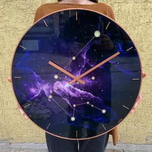 Beautifully crafted Aquarius wall clock with glowing elements. Perfect for home decor, this oversized clock combines functionality with artistic style, making it a unique gift for astrology lovers. Oversized wall clock. Large wall clock. Big clock.