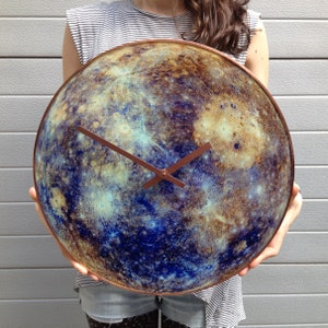 Elegant Mercury glass clock, featuring glow-in-the-dark magic. This celestial decor piece is perfect for modern interiors or as a unique gift for Gemini and Virgo zodiac signs. Handcrafted with an astronomy theme.
