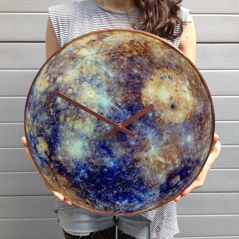 Elegant Mercury glass clock, featuring glow-in-the-dark magic. This celestial decor piece is perfect for modern interiors or as a unique gift for Gemini and Virgo zodiac signs. Handcrafted with an astronomy theme.