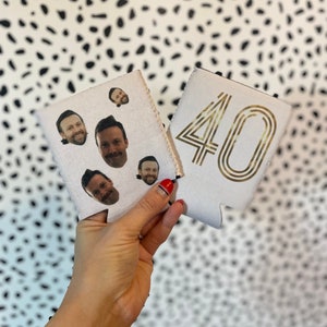 May include: Two white can coolers, one with a gold number "40" and the other with a collage of four different men's faces.