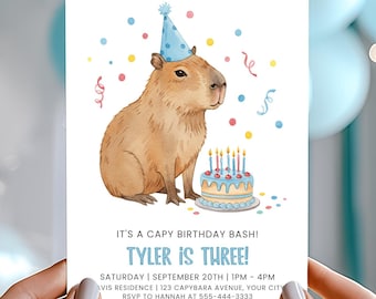 May include: A birthday invitation featuring a watercolor illustration of a capybara wearing a party hat, with a birthday cake. The text reads "It's a Capy Birthday Bash! Tyler is Three!" with event details.