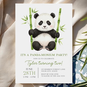 May include: A white invitation card with a panda illustration. The panda is black and white, holding onto bamboo stalks. Text on the card reads "IT'S A PANDA-MONIUM PARTY!" and "Tyler turning two!" with the date, time, and RSVP information.