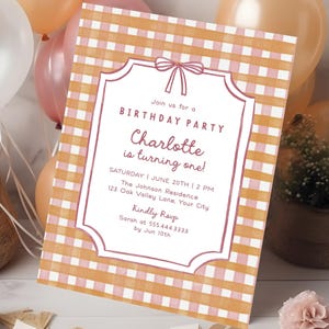 May include: A birthday party invitation with a pink and orange gingham pattern. The invitation has a decorative border and text that reads "Join us for a Birthday Party, Charlotte is turning one!" Balloons and floral accents are in the background.
