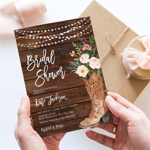 May include: A rustic bridal shower invitation with a woodgrain background, string lights, and a floral arrangement in a brown cowboy boot. The text reads "Bridal Shower" and "Kate Jackson".