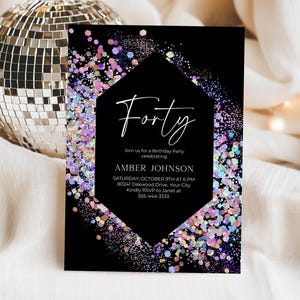 May include: A rectangular birthday party invitation card featuring a black background with a central diamond shape containing the text Forty, Amber Johnson, and event details. The card is decorated with iridescent purple and silver glitter.