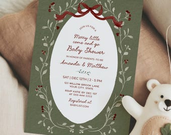 May include: A rectangular baby shower invitation card with a dark green background, featuring a white oval center with red text that reads: Join us for a Merry little come and go Baby Shower in honor of parents-to-be Amanda & Matthew.