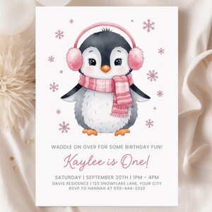 May include: A birthday invitation featuring a watercolor illustration of a penguin wearing pink earmuffs and a scarf. The text "Kaylee is One!" is displayed in a cursive font, along with event details.