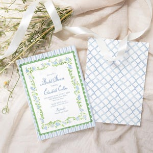 May include: A blue and white striped card with a green border and floral design. The card reads "Bridal Shower honoring Elizabeth Collins".