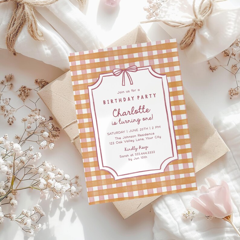 May include: A birthday party invitation with a gingham pattern in shades of orange and pink. The invitation features a decorative frame with the text "Join us for a BIRTHDAY PARTY Charlotte is turning one!" and event details.
