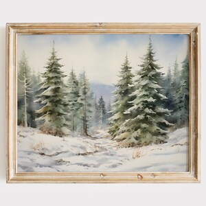 May include: A watercolor painting of a snowy forest scene with tall evergreen trees. The trees are painted in shades of green and brown, and the snow is white. The painting is framed in a light wood frame.