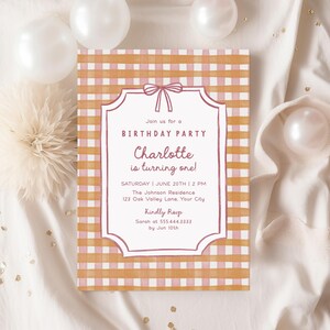 May include: A birthday party invitation with a pink and orange gingham pattern background. The invitation has a white frame with a pink bow at the top. Text reads "Join us for a BIRTHDAY PARTY Charlotte is turning one!"