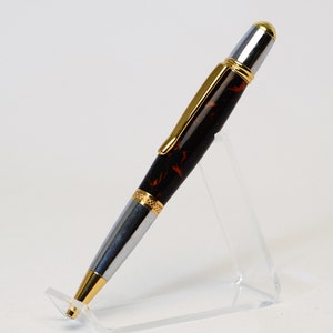 One of a Kind Classic Twist Pen in Gold Titanium and Chrome with Handcrafted Black and Orange Acrylic Body