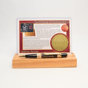 Handcrafted Pen Made With a Swatch From A Lebron James Game Used Jersey and Wood From Quicken Loans Arena Floor