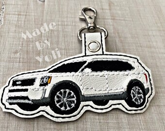 T ride Keychain