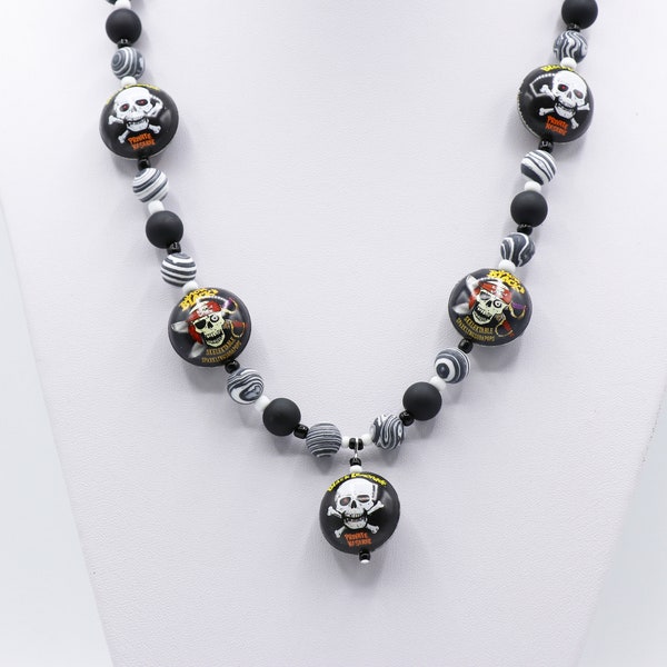 Black and white bottle cap necklace with skull and crossbones.  Striped malachite beads.  Pirates and halloween