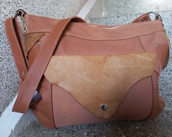 large leather bag to hang around your body in cognac brown