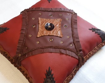 Filled leather cushion in country house style