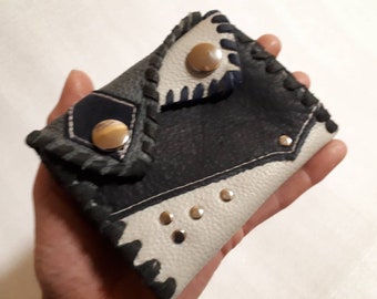 small unusual leather wallet with snap fasteners and rivets