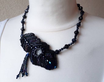 Opulent, extraordinary necklace with beaded black feather