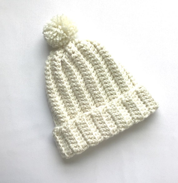 girls cream bobble hat