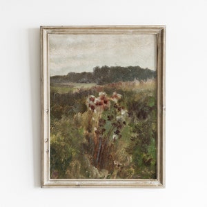 May include: A framed oil painting depicting a landscape scene with a field of wildflowers in the foreground and a forest in the background. The painting is done in muted tones of green, brown, and white.