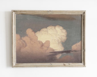 May include: A framed vintage painting of a cloudscape. The artwork features a large, fluffy cloud formation in shades of peach and white against a dark blue-grey sky. The painting is housed in a silver-toned frame.