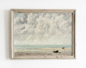 Puede incluir: Una pintura enmarcada que representa un paisaje marítimo con un cielo nublado, una playa de arena y dos pequeños barcos en la distancia.