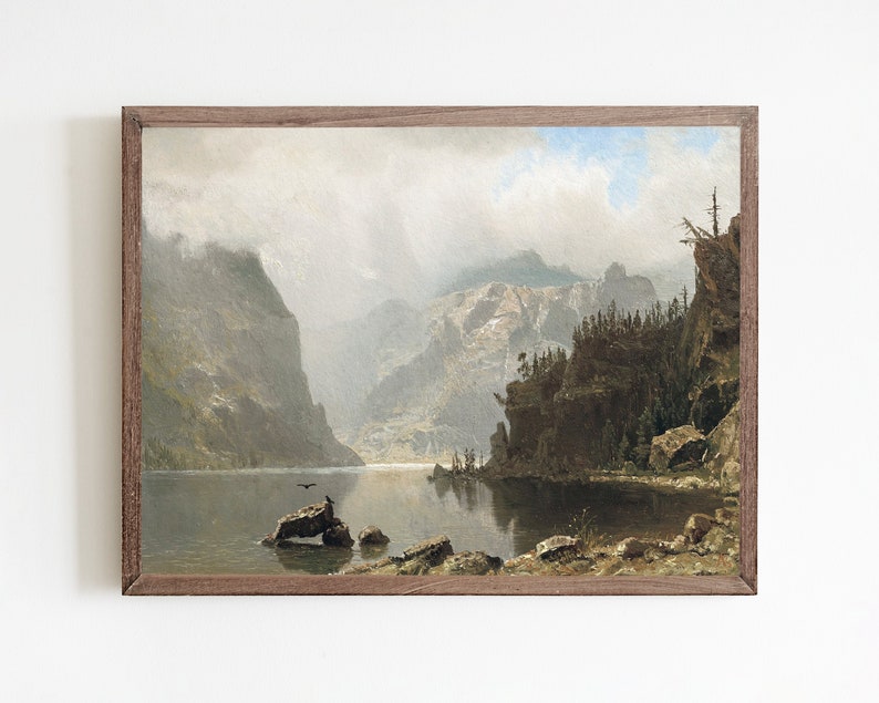 May include: A painting of a mountain lake scene with a dark blue lake, green trees, and brown mountains in the background. The sky is a light blue with white clouds.