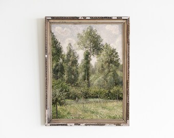 May include: A framed oil painting depicting a lush green forest scene with tall trees and a grassy meadow in the foreground. The painting is in a simple, rustic frame with a light brown finish.