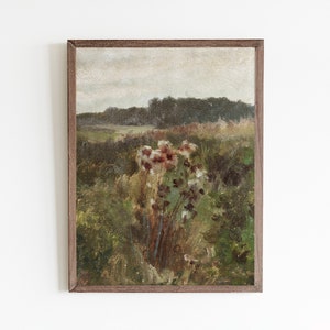 May include: A framed painting of a landscape with a field of wildflowers in the foreground and a forest in the background. The sky is cloudy and the colors are muted.